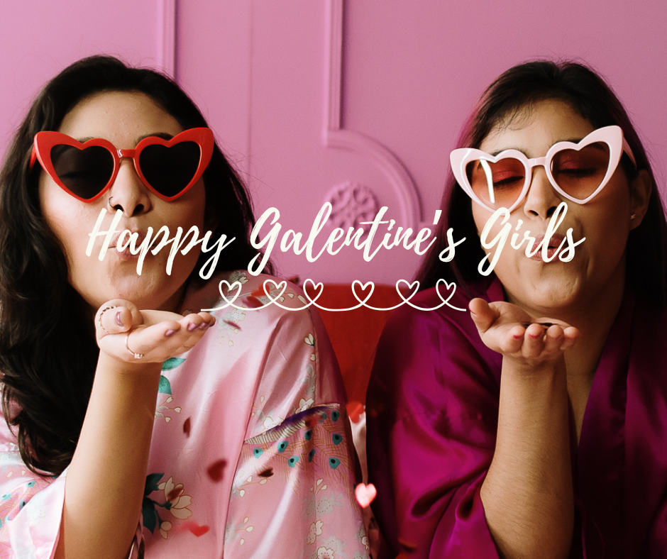 Two women wearing heart sunglasses and blowing kisses