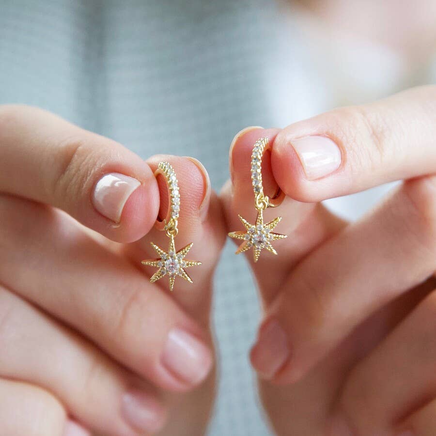 Crystal star huggie hoop earrings in gold